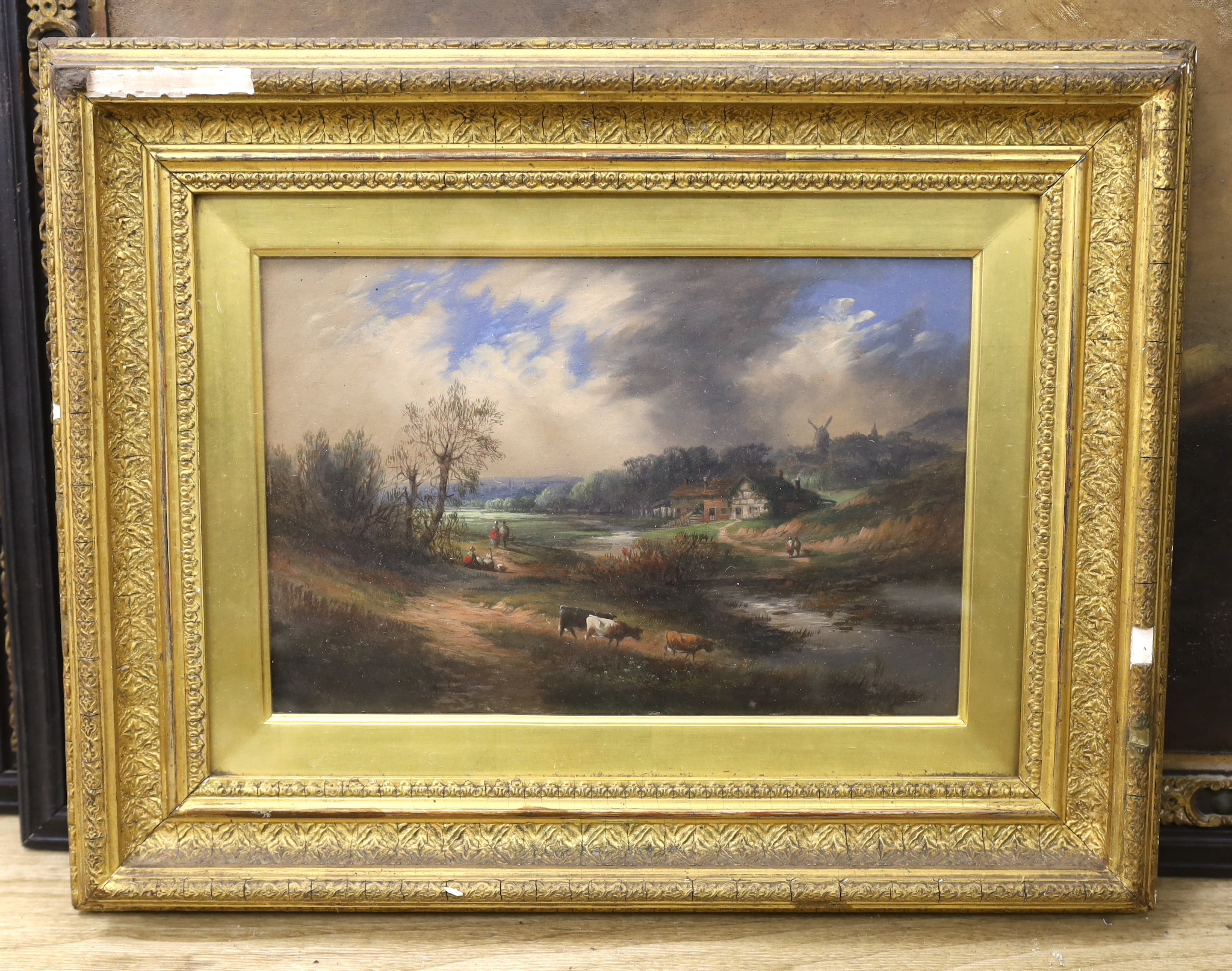 19th century Continental School, oil on board, River landscape with cattle, unsigned, 19 x 30cm, housed in an ornate gilt frame